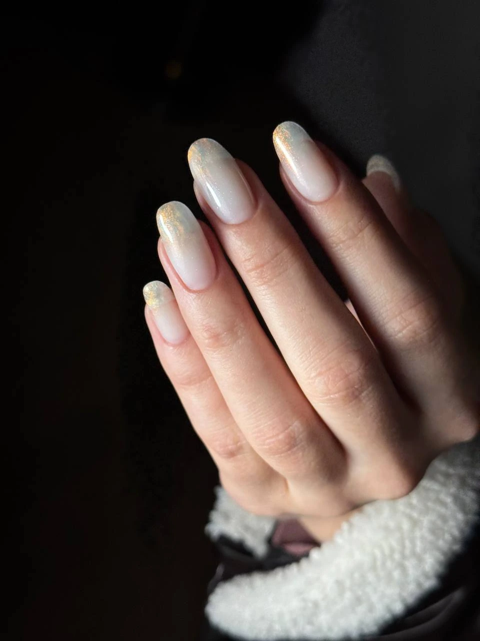 Nail technician showing manicure tools